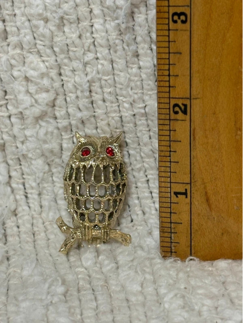 Owl brooch with red rhinestone eyes